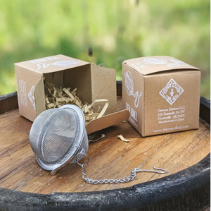Tea ball infuser on top of barrel with packaging