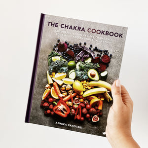 Hardcover version of The Chakra Cookbook with colorful vegan recipes