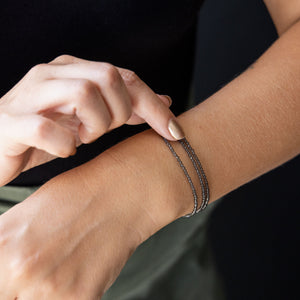 smoky quartz seed bead bracelets on a wrist
