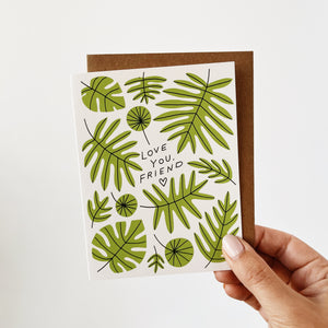 Greeting Card with green leaves and love you, friend text