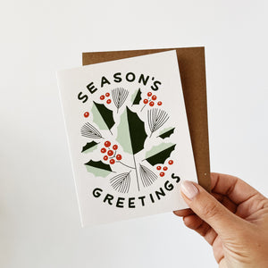 Season's Greetings card with holly leaves and berries