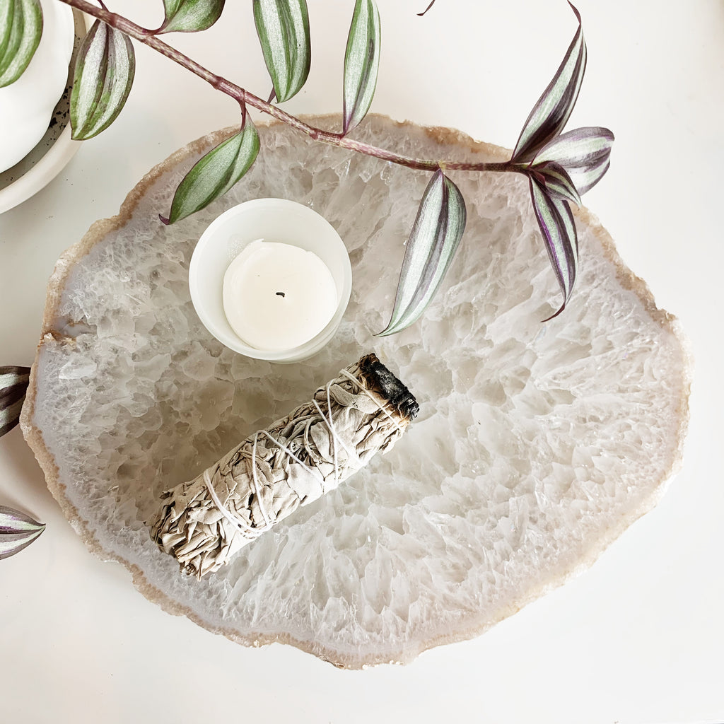 Top view of a large Agate tray with sage smudge stick and tea light candle on top.