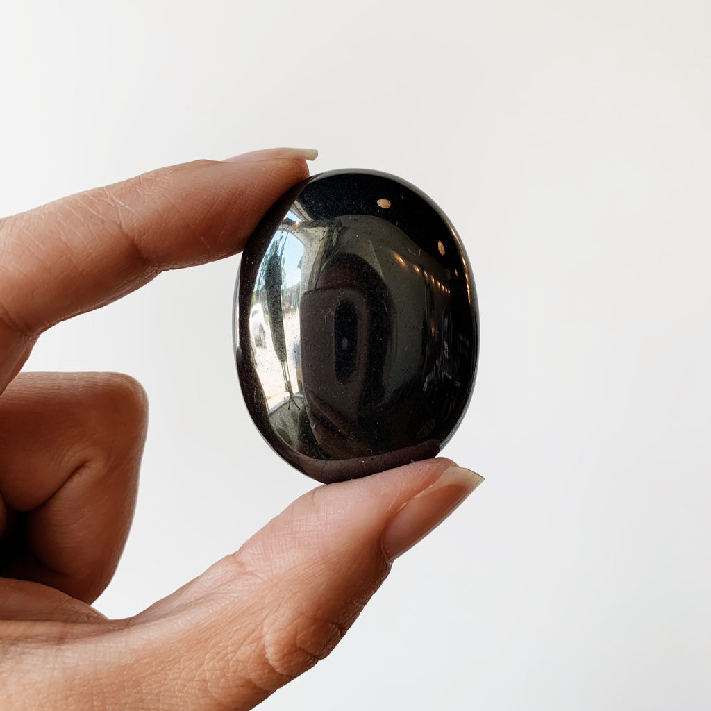 Hematite palm stone
