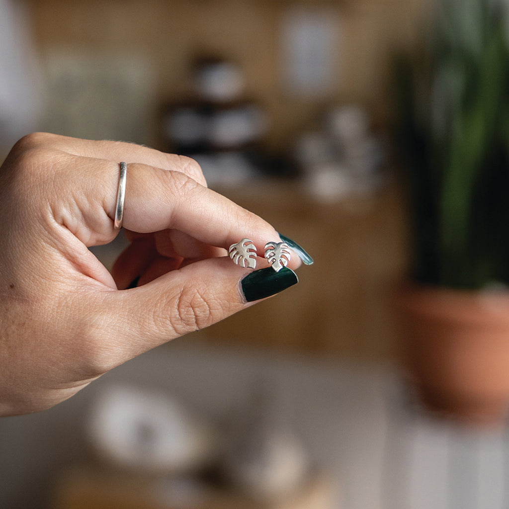 Silver monstera stud earrings