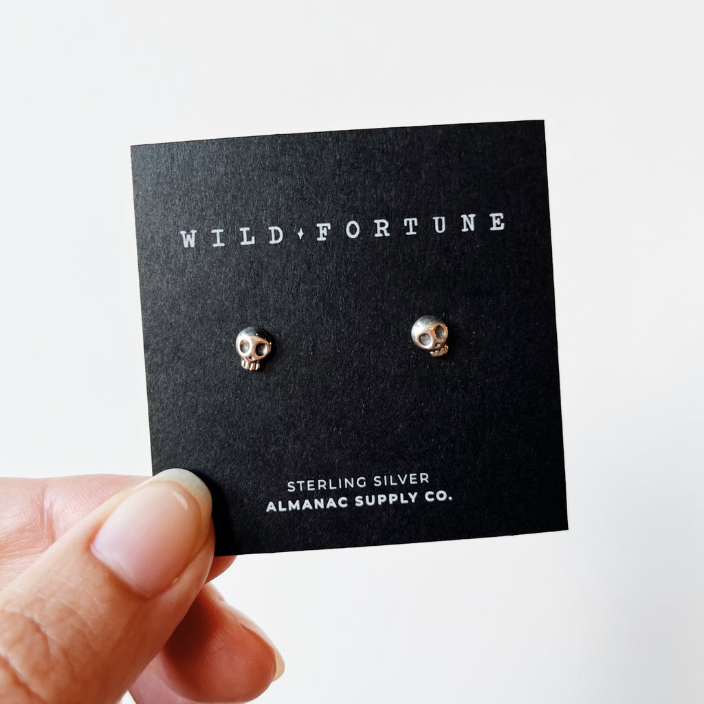 Silver skull stud earrings