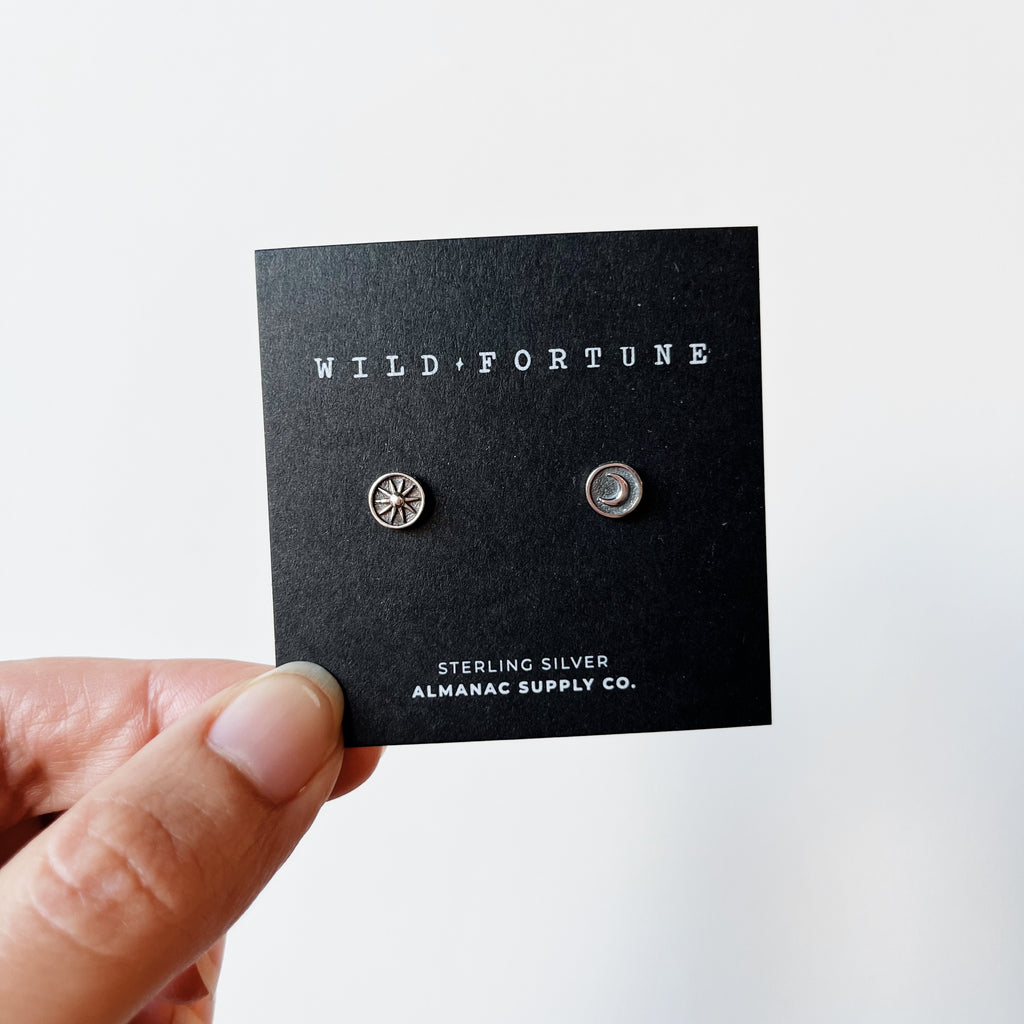 Silver sun and moon stud earrings