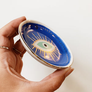 Side view of a ceramic evil eye ring dish