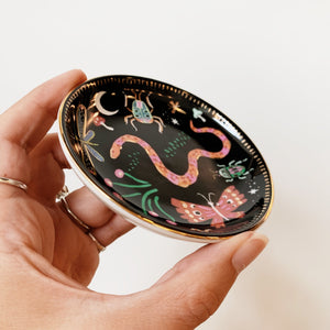 Side view of ceramic trinket dish with gold edge
