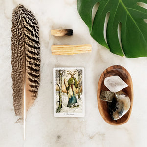 The Ancestor card, turkey feather, and crystals