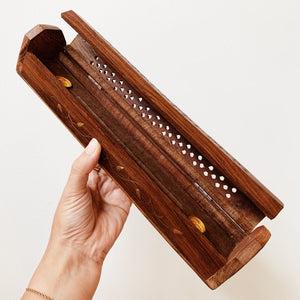 Inside of wooden incense box