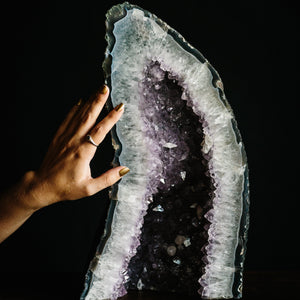 Large Amethyst cathedral with hand for scale