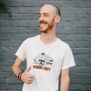 Black and white Scenic City t-shirt, orange text reads “Scenic City”